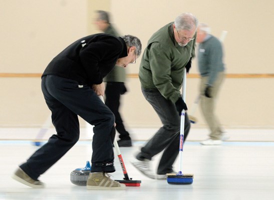 Gino Vazzoler (left) and Tom Howe work on their sweeping.