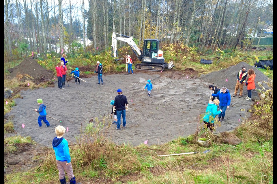 Volunteers work on the new Valleyclieffe Elementary wetland.