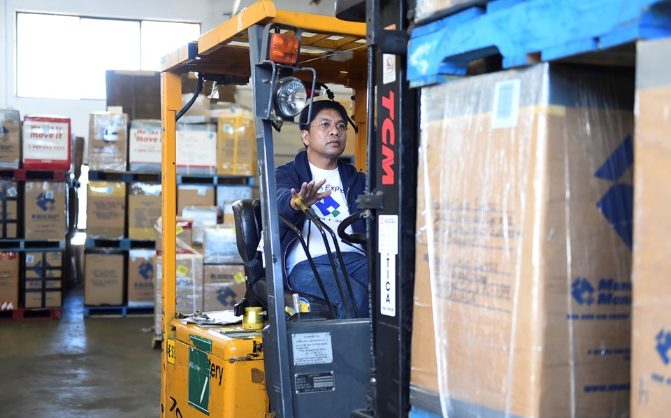 In a warehouse in Richmond, every balikbayan box sent through Manila Cargo Express passes under Noem