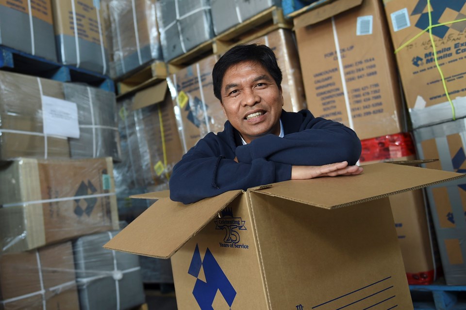 Noemi Tabrilla oversees the thousands of care packages known as balikbanyan boxes that make their way from Canada to the Philippines. Photo Dan Toulgoet