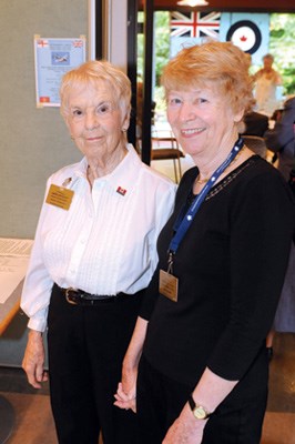 Nenia Kennedy (left) and Mel Clark help out at the lunch.