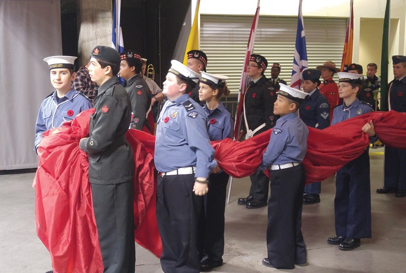 LC Jacob Poirier and AC Lily Karkbe of the Sunshine Coast Navy League and Sea Cadets helped carry out the giant Canadian flag at the opening ceremony for the BC Lions games.