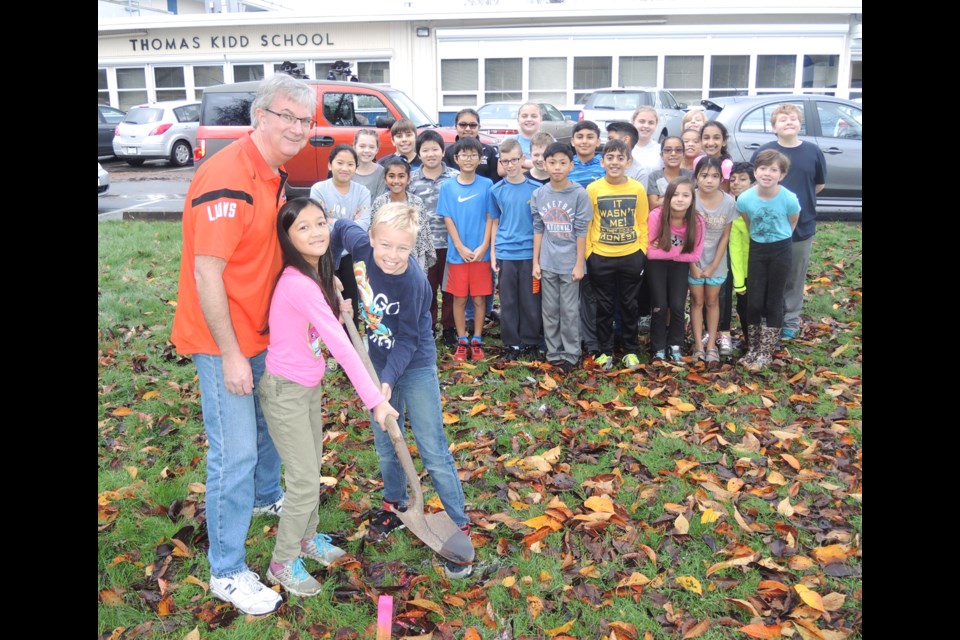 Thomas Kidd Grade 5 and 6 teacher Russ McMath and his students, including Naiya Harlow (front centre) and David Aibaum, are looking forward to exploring the ground outside their school for what may be a time capsule buried in 1967.