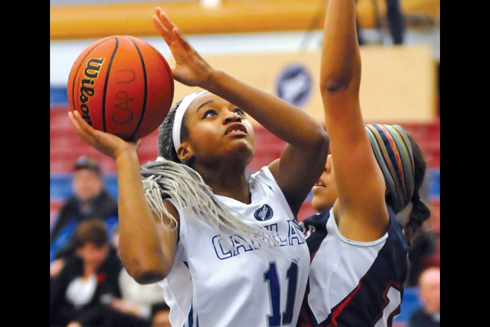 Carmelle M'Bikata of the Capilano women's basketball team goes up strong during a 77-32 win over Columbia Bible College Nov. 10 at the Capilano Sportsplex. photo by Paul McGrath, North Shore News