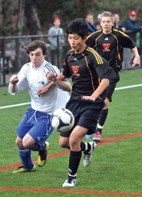 Handsworth (white) and West Vancouver (black) at William Griffin field in senior boys AA soccer playoffs.