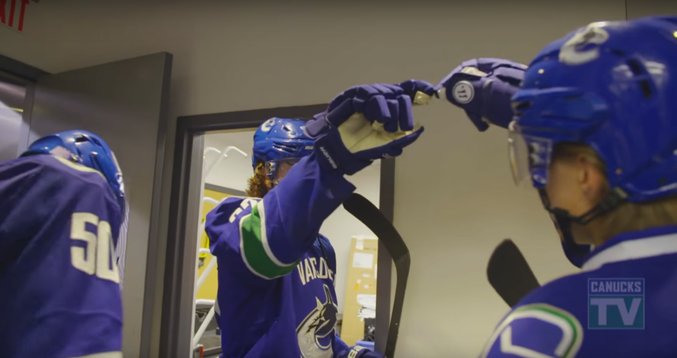 Ben Hutton and Markus Granlund finger bump