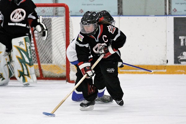 West Vancouver native Melanie Thomas starts the rush for the Lower Mainland Thunder in the NRL championships game. Thomas was named a first-team all-star after the Thunder's victory over Montreal.