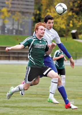 Argyle's Scott Young (green) and Handsworth's Chris Noble in AAA senior boy's soccer action at Sutherland field.