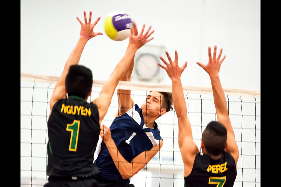 Moscrop forced the Lower Mainland final to a fifth-and-deciding game last week, before Van Tech prevailed 3-2. Above, Moscrop’s Aleks Ristic delivers a smash at the net.