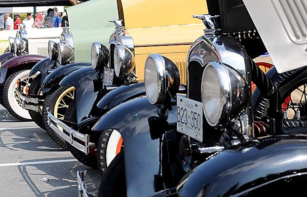 A lineup of Ford Model A's.