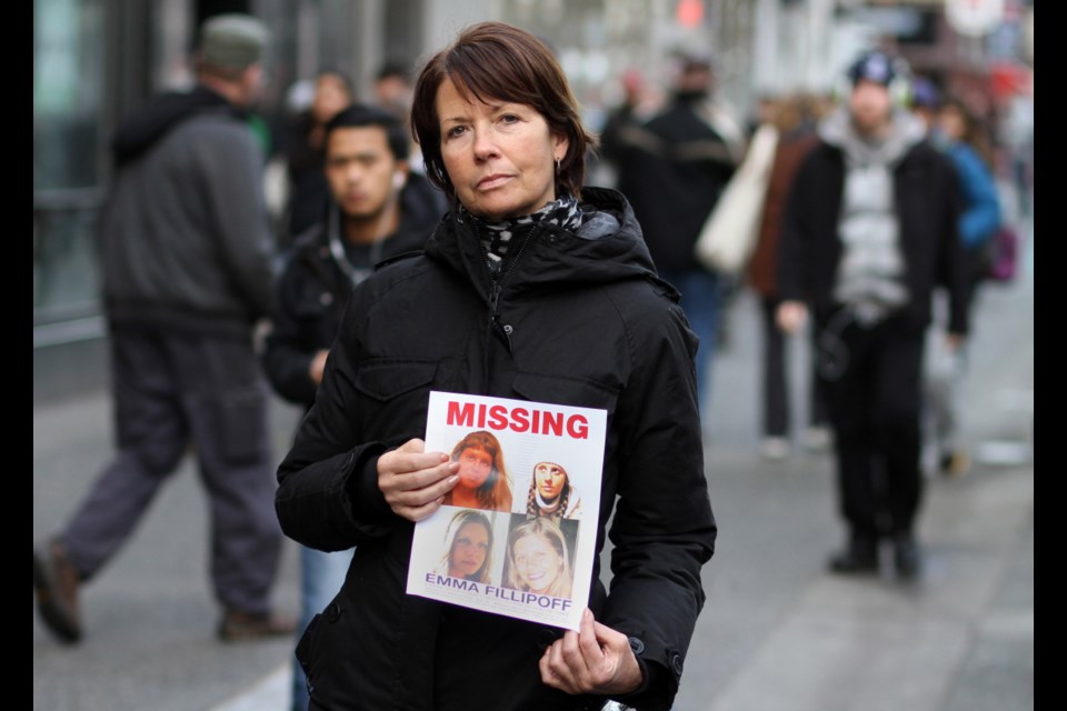 Shelley Fillipoff is shown in January 2013 holding a sheet of photos of her daughter, Emma. Shelley continues to keep her daughter's name in the public eye after four years of fruitless searching.