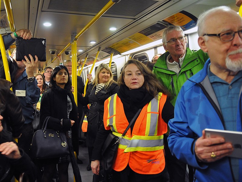 A group that includes Coquitlam-Burke Mountain BC NDP MLA Jodie Wickens takes a ride on the Evergreen Extension on Monday night.