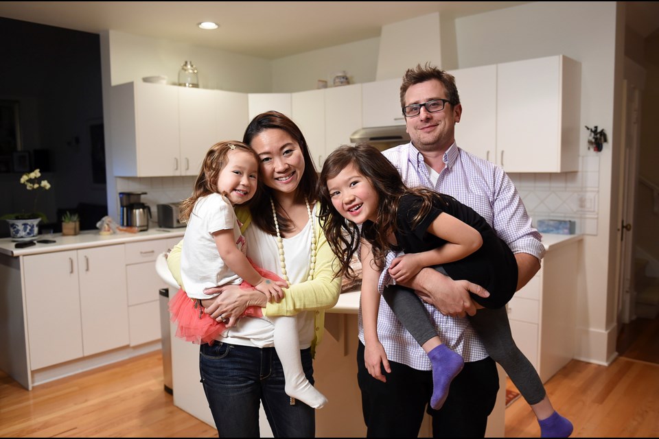 Mike and Cherie Lang want to buy a place to establish roots, stability and housing security for their two daughters, Kayla and Ashlynn. They feel the "cohousing lite" model is a good fit. Photo Dan Toulgoet