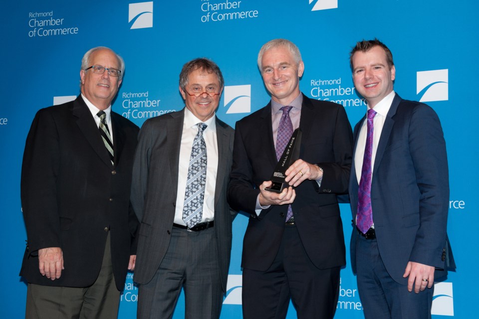 Harold Goodwyn, (second from right) accepts the Hall of Fame award on behalf of RCG Group, which has been responsible for numerous industrial, commercial and retail developments in Richmond. Photo by Rob Newell/Special to the News