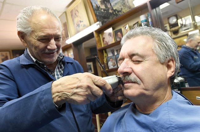 George Blanis shaves off Prince George Mayor Lyn Halls moustache Thursday morning. Mayor Lyn Hall raised $5,718 to beat Kamloops Mayor Peter Milobar in the friendly Movember challenge that was issued early in November. Kamloops raised a total of $4,266.