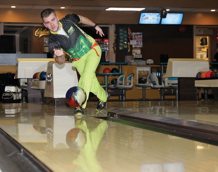 Stephen Meakin, a 23-year-old local 10-pin bowler, delivers a ball at Strike Zone. Meakin recently bowled back-to-back perfect games during league play.