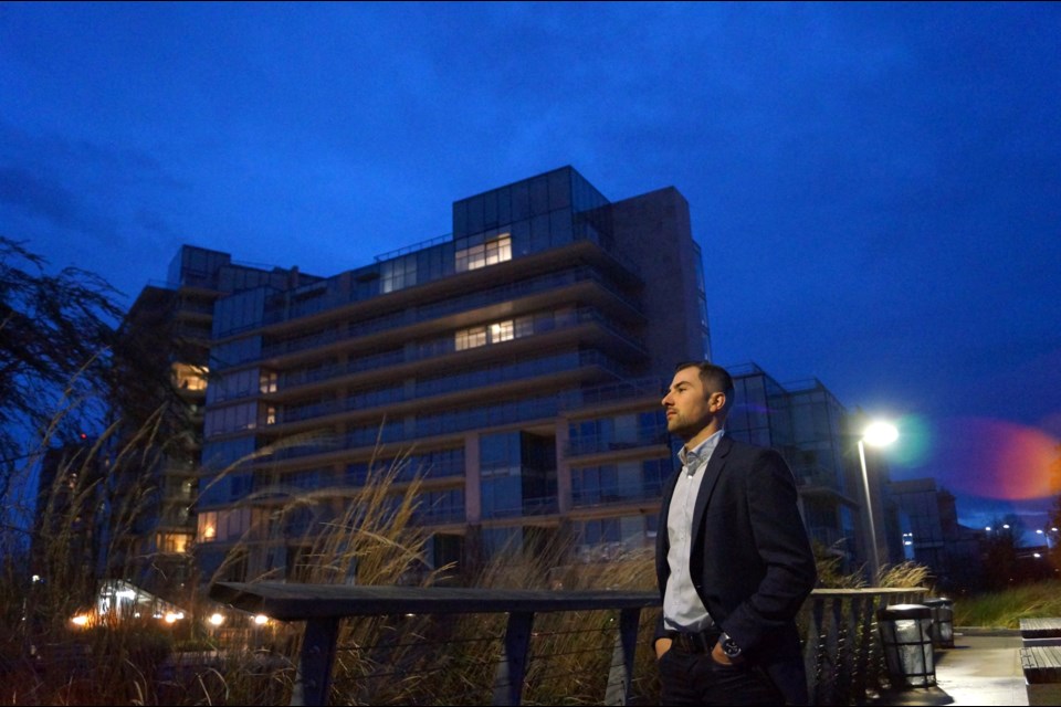 Richmond-born realtor Steve Saretsky stands in front of the four-year-old River Green development, which appears more empty than occupied.