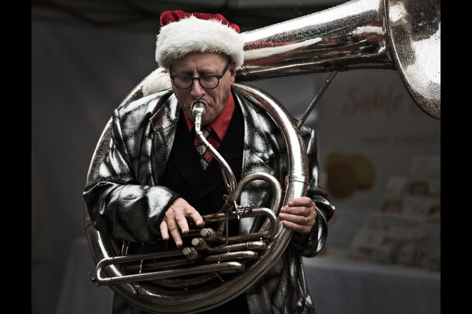 CandyTown festival goers were treated to live Christmas songs performed by local musicians who braved the wet weather this past Saturday in Yaletown. Photo Rebecca Blissett. Read story here.