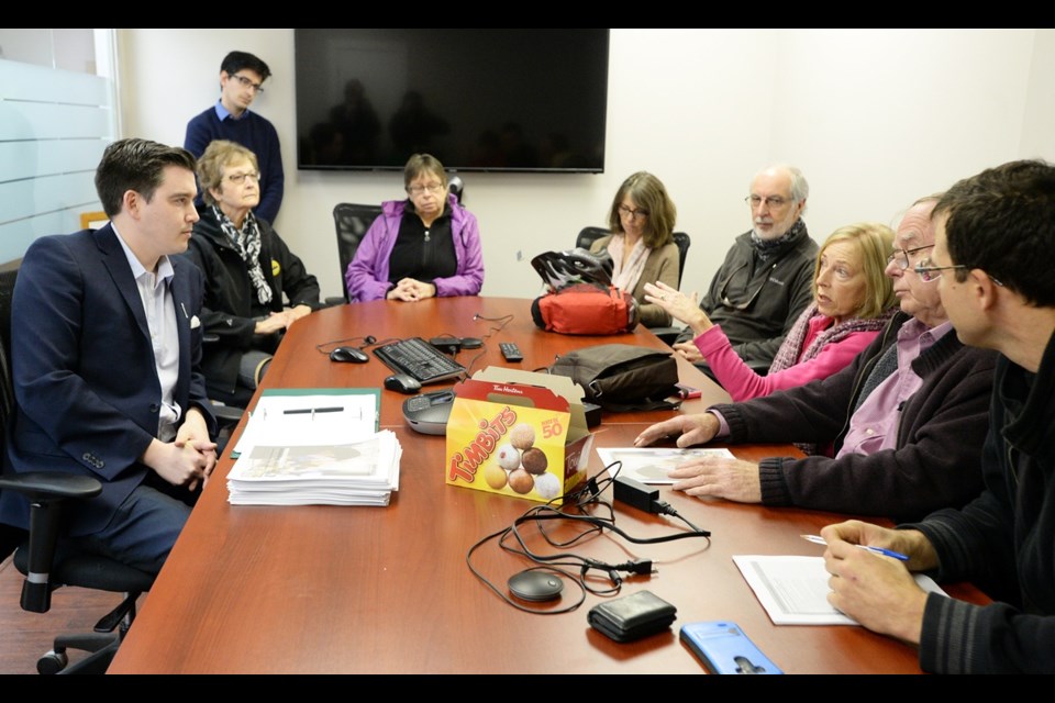 Terry Beech, Liberal MP for Burnaby North-Seymour, speaks with constituents during an open house on Saturday.