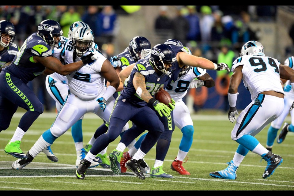 Seattle Seahawks running back Thomas Rawls (34) heads upfield on his way to the end zone for a touchdown against the Carolina Panthers in the first half on Sunday at CenturyLink Field in Seattle.