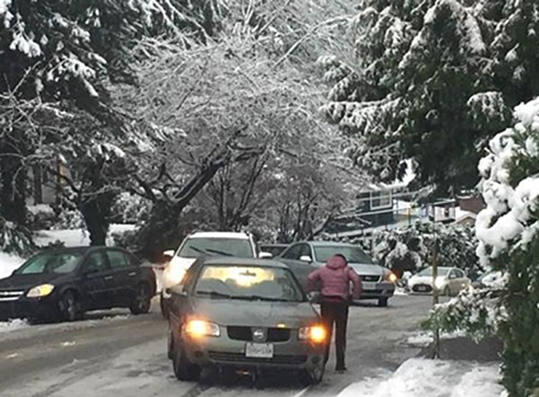 Cars struggle to get up the hill on Thermal Drive in Coquitlam. Councillor Dennis Marsden, who took this photo, reported that he and his neighbours pushed and shoveled no fewer than six cars within 30 minutes to help them get rolling along.