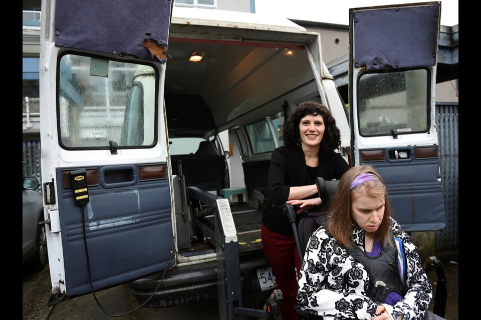 Laura Johnson, fund development officer with the Greater Vancouver Community Services Society, describes the society’s aging van as a “life line” for residents. Photo Dan Toulgoet