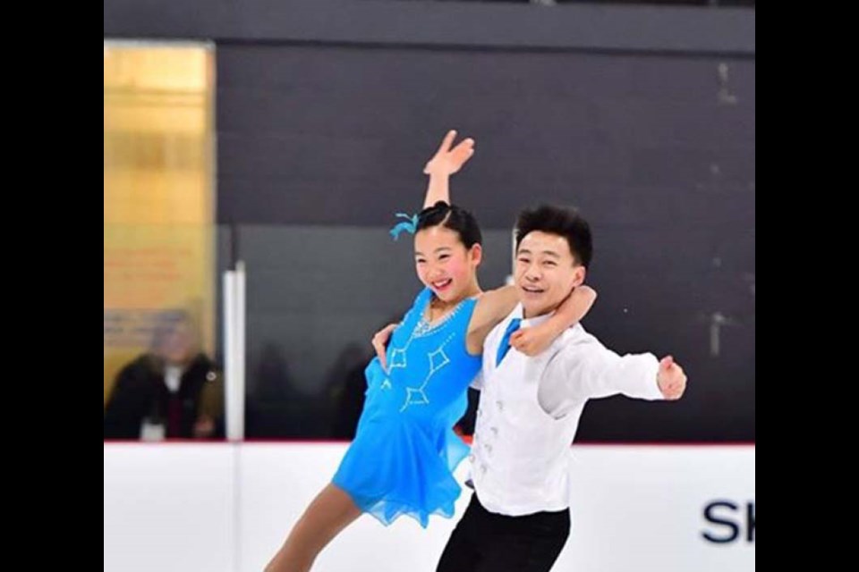 Port Moody Inlet Skating Club member Miku Makita skates with Tyler Gunara during the 2017 Skate Canada Challenge in Quebec last week.