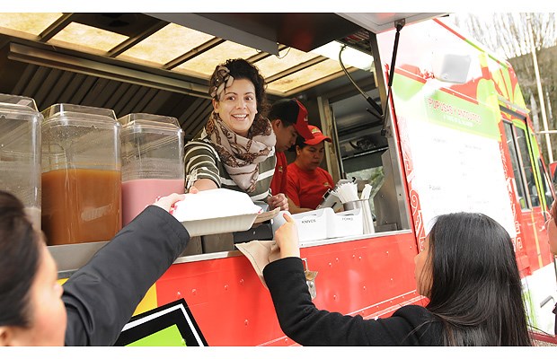 Twelve new food vendors will join the rest of the food vendors already operating in the city. Four were on hand at city hall Monday morning. Guanaco Salvadoran Cuisine's Veronika serves customers at city hall Monday.