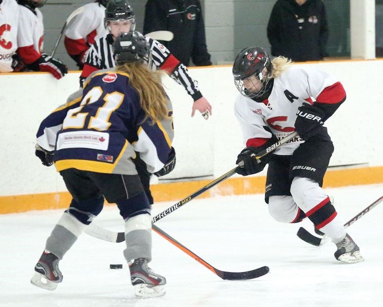Prince George Bantam Female Cougars Braxtyn Shawara looks for a way around Williams Lake Timberwolves Sienna Monical on Feb. 27 at Kin 3.