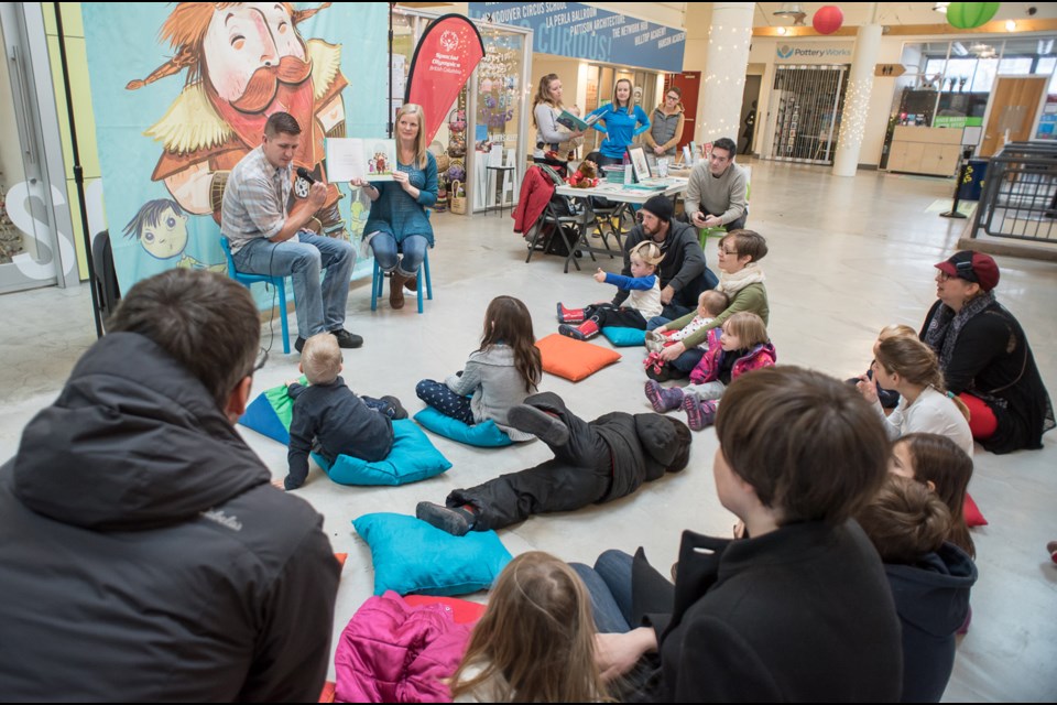 Grayson Smith reads from his new book, There's a Norseman in the Classroom!, during a launch event at River Market Saturday.
