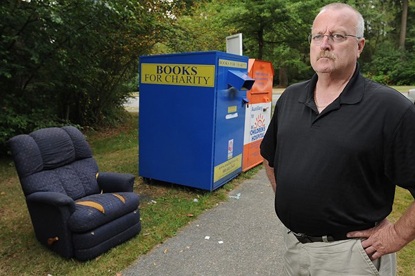 Champlain Heights resident Rick Evans says the number of charity bins popping up across the city is out of control. The bins are attracting
garbage and junk of all sorts, including furniture, small appliances and surplus bags of used clothing, which gets sorted and strewn around by
curious passersby.