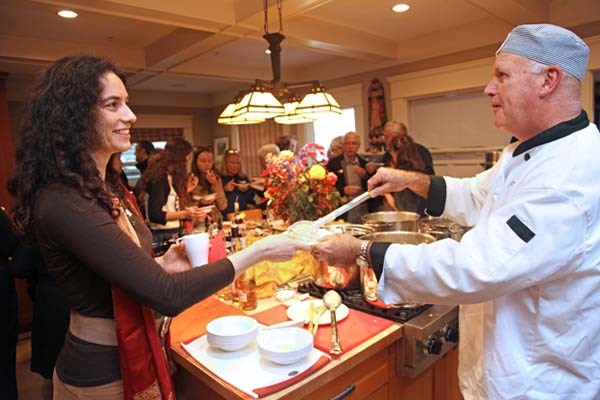 L-R, Porridge Professorship recipient Dr. Silke Cresswell receives porridge from volunteer Collis Wilson at the Porridge for Parkinson's event. Sunday, Nov. 18th.