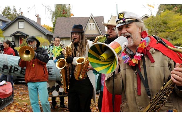 Russ Barrett with the Carnival band gets started in the park before the walk.