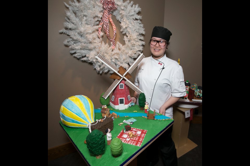 Inn at Laurel Point pastry chef Kimberley Vy with her team&ecirc;s entry, The Retirement Plan at Gingerbread Showcase.