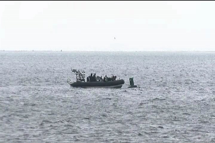 A search crew scans Baynes Sound. photo
