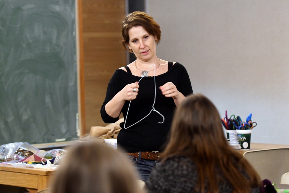 Denise Corcoran of Thrifty By Design leads a "crafternoon" session at the library.