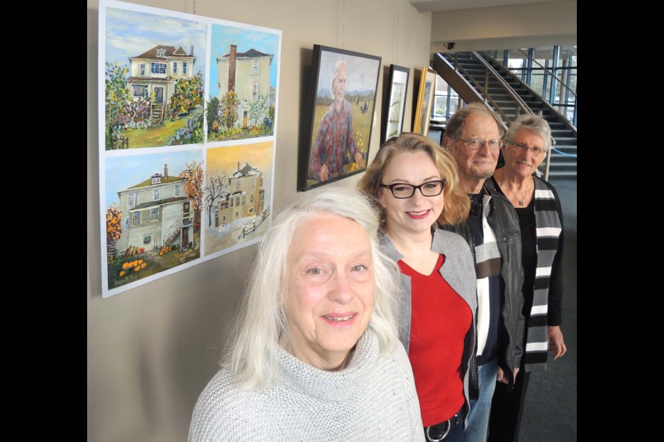 Men in Hats artists, including (from left) Lorraine Wellman, Jennifer Heine, John Beatty and Margareth Fry, spent time painting scenes from the Steves Farm before showing off their work at Gateway Theatre.