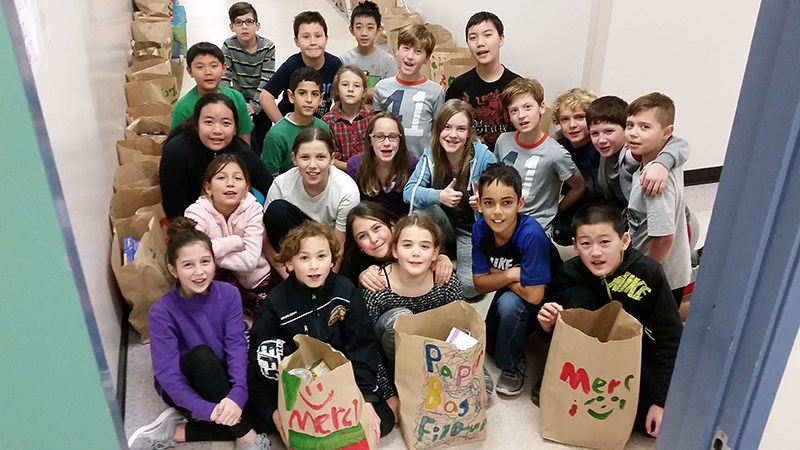 Rochester elementary school students participated in a holiday hamper campaign, collecting 140 bags of food and toiletries.