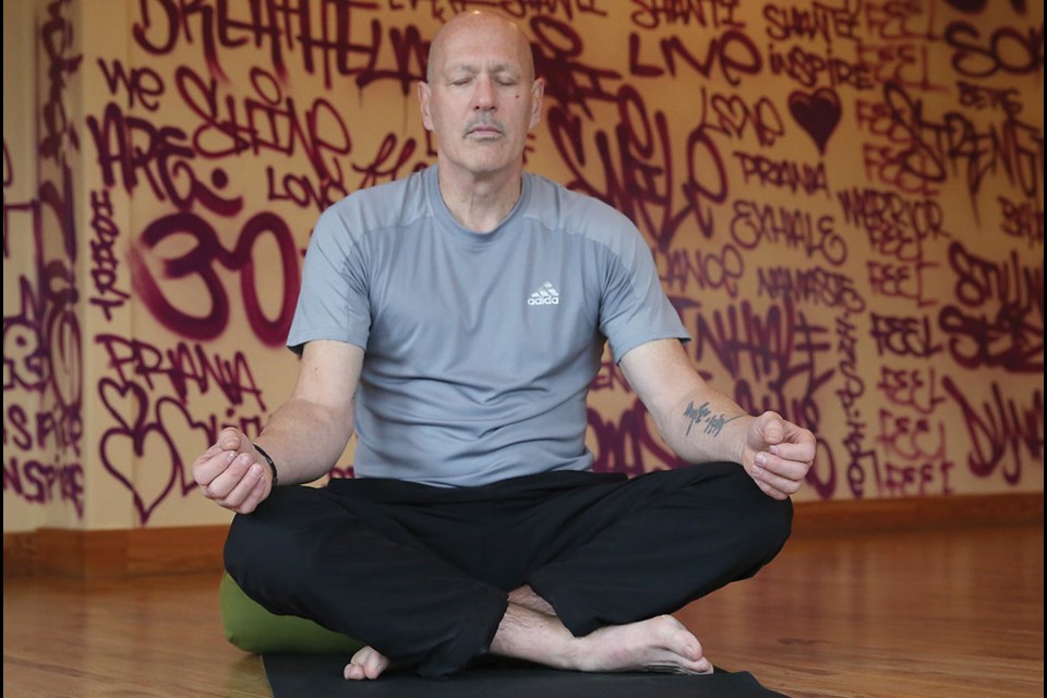 Rob Richards practices yoga at Chinook Yoga. Richards, is a victim of violence and uses yoga as a big part of his healing. Citizen Photo by James Doyle