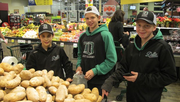 Delta Wild players worked at Wagner Hills farm earlier this month in order to buy food for Christmas hampers at Save-On-Foods.