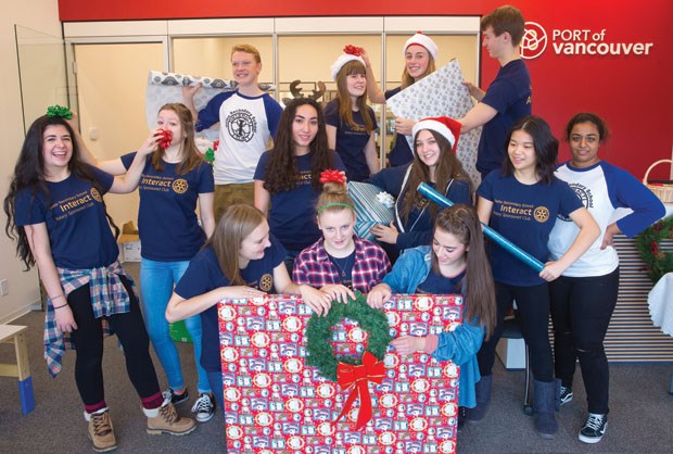 Members of Delta Secondary’s Interact Club wrap gifts by donation at the Port of Vancouver’s community office in Ladner’s Trenant Park Square last weekend. The annual fundraiser benefits the Delta Life Skills Society.