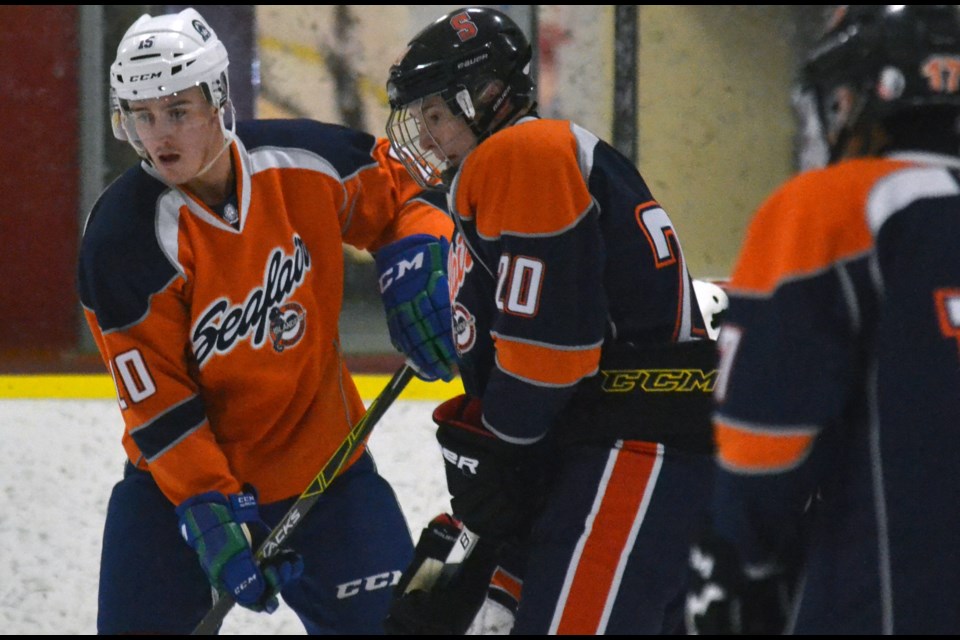 St. Louis Blues prospect and Swift Current Broncos captain Glenn Gawdin (left) was back in a Seafair jersey for the first time in about six years when he took part in the Bantam A1 Islanders first-ever alumni game on Dec. 22 at the Richmond Ice Centre.