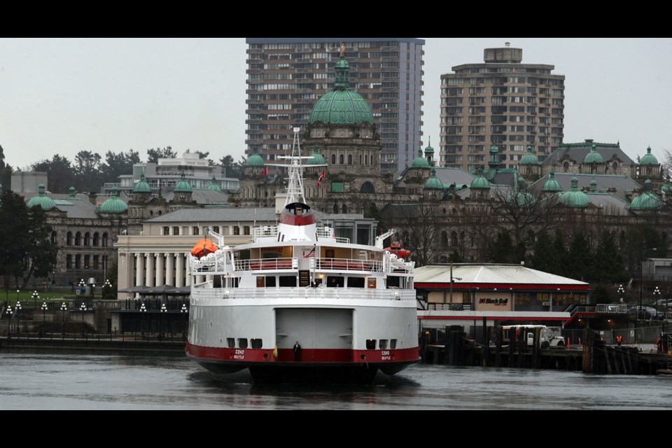 MV Coho ferry departs Victoria's Inner Harbour in late afternoon for its daily passage to Port Angeles, Washington.