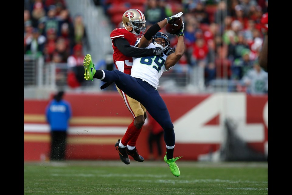 Seattle Seahawks wide receiver Doug Baldwin (89) makes a catch against San Francisco 49ers defensive back Rashard Robinson (33) in the second quarter at Levi's Stadium in Santa Clara, Calif., on Sunday. The Seahawks won, 25-23.
