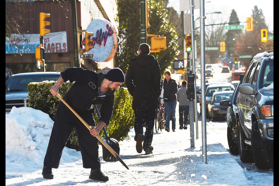 All property owners and landlords are responsible for clearing snow and ice from sidewalks that surround their property by 10 a.m. the morning after a snowfall. Photo Dan Toulgoet