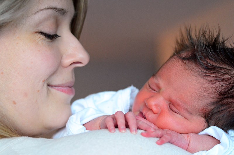 Baby Tiana sleeps on her mom, Maria Savisko’s shoulder.