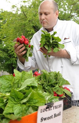 Chef Joe Chaput from Au Petit Chavignol shops at the Farmers Market at Thornton Park.