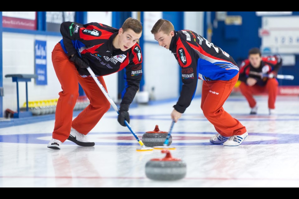 Jordan Tardi and Sterling Middleton move down ice during early round action at last week's B.C. junior men's curling championship in New Westminster.