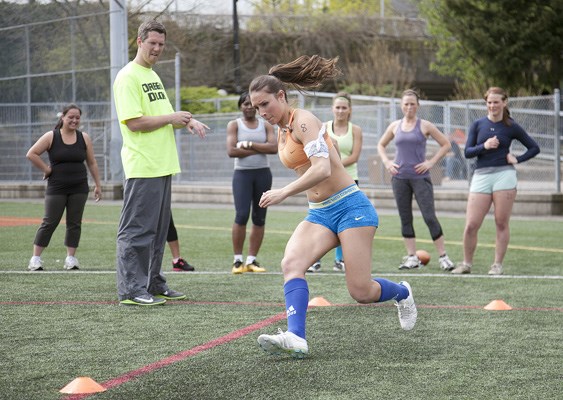 League includes 12 American1: B.C. Angels coach Kevin Snell tests a player's agility at a tryout April 22.