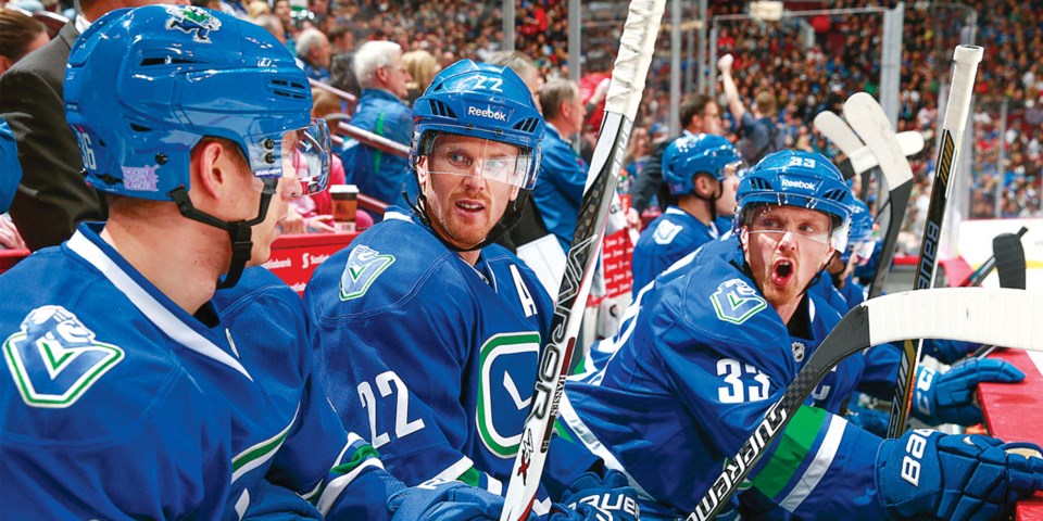 Henrik Sedin yells at Jannik Hansen.